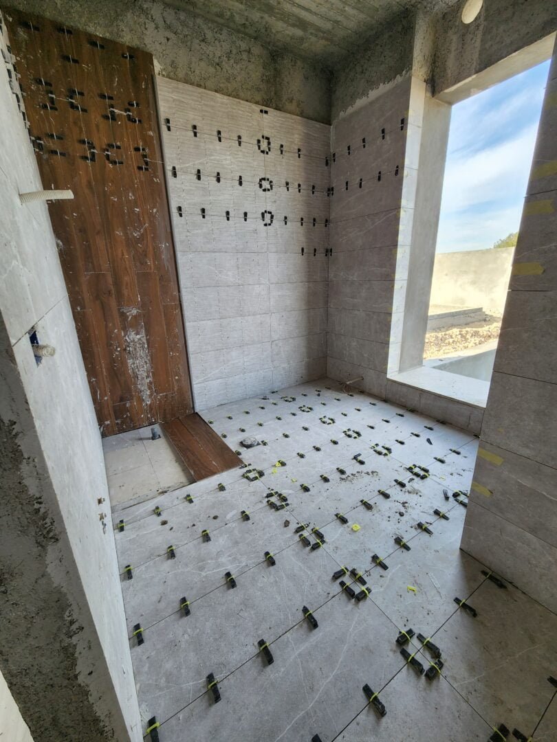 Tiling Works by Precision Construction