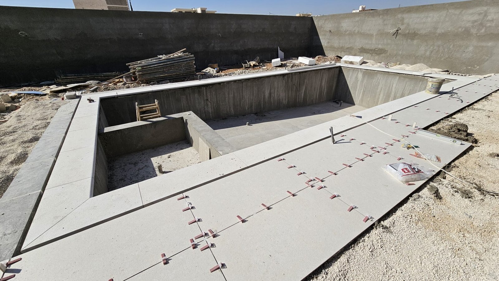 Tiling Works by Precision Construction