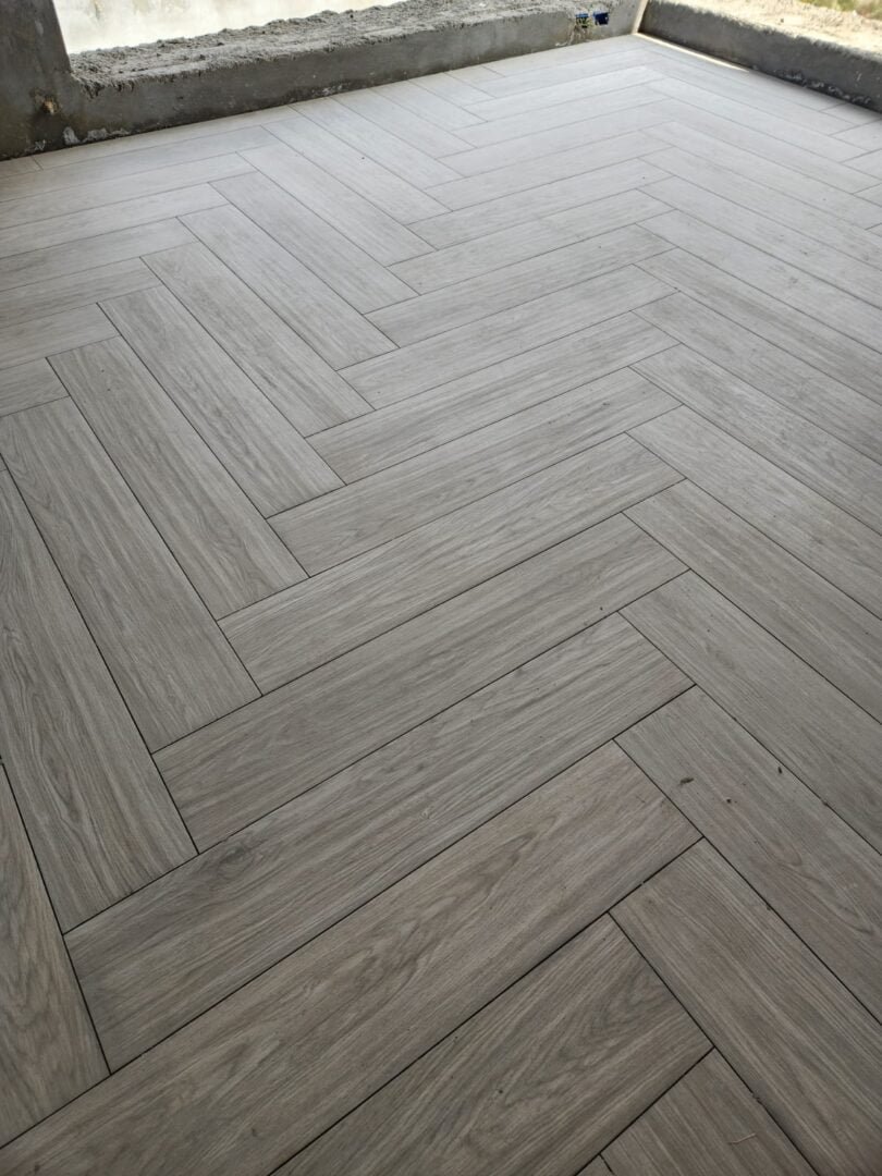 Tiling Works by Precision Construction