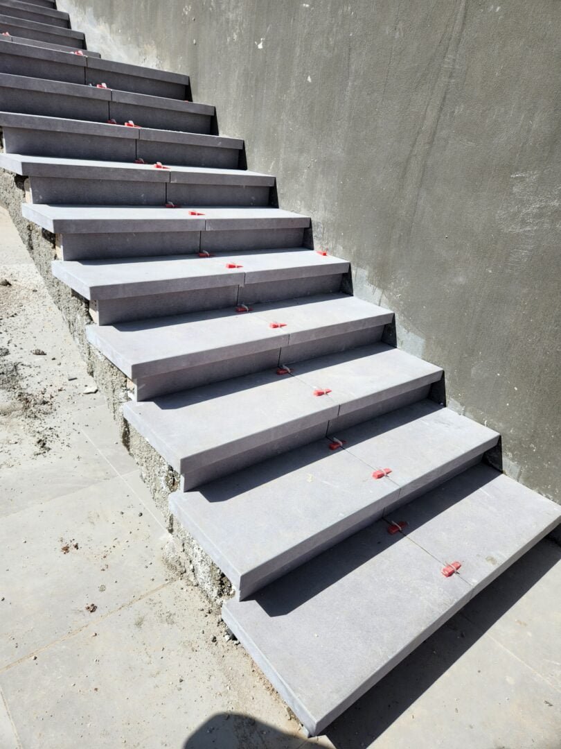 Tiling Works by Precision Construction