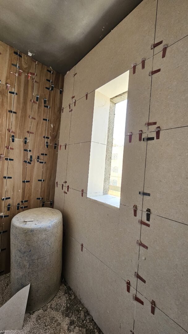 Tiling Works by Precision Construction