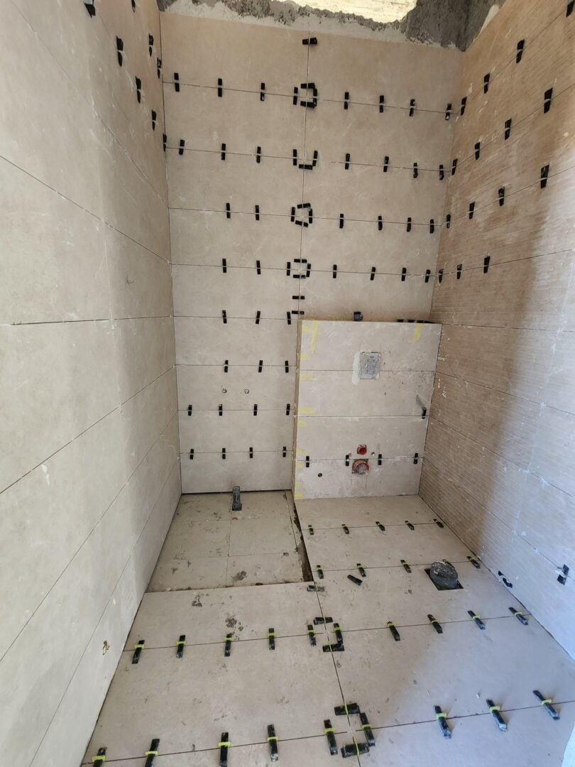 Tiling Works by Precision Construction