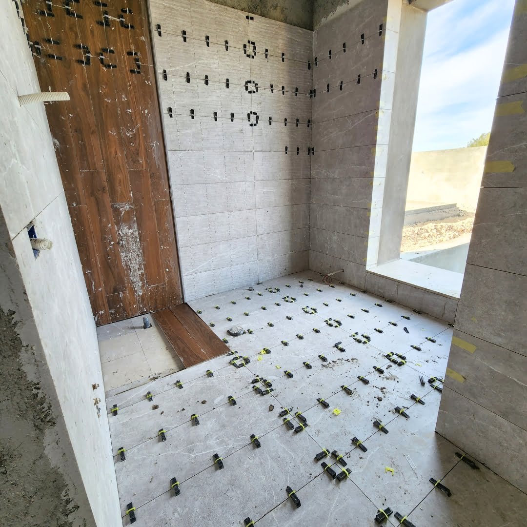 Tiling Works by Precision Construction